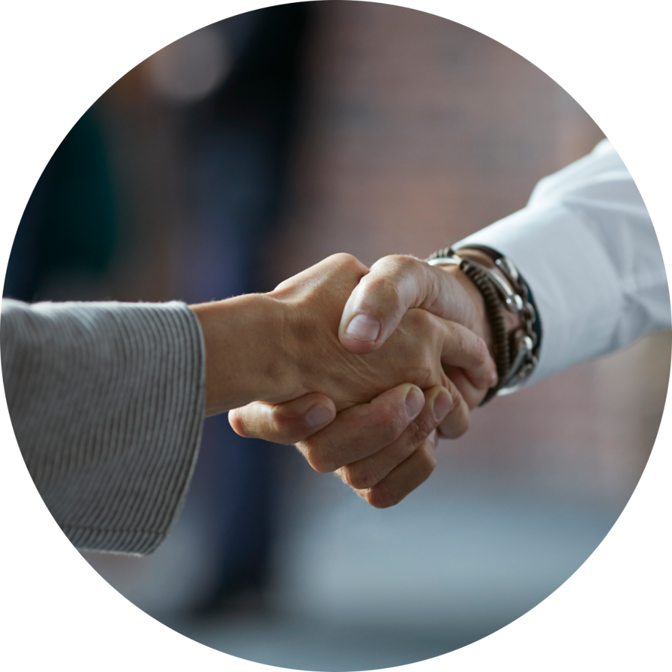 Close-up of handshake between two individuals